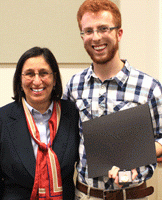 Matthew Riedl of Andover, Kan. received the 2013 St. Catherine's Medal, the highest honor bestowed on a Newman student. With Riedl is Newman President Noreen M. Carrocci.