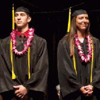 Graduating senior students Brice Albert, left, and Adrienne Fox listen as Newman Provost and Vice President for Academic Affairs Michael Austin, Ph.D. announces them as recipients of the 2013 Ablah Awards at the Spring 2013 Commencement ceremony May 11.