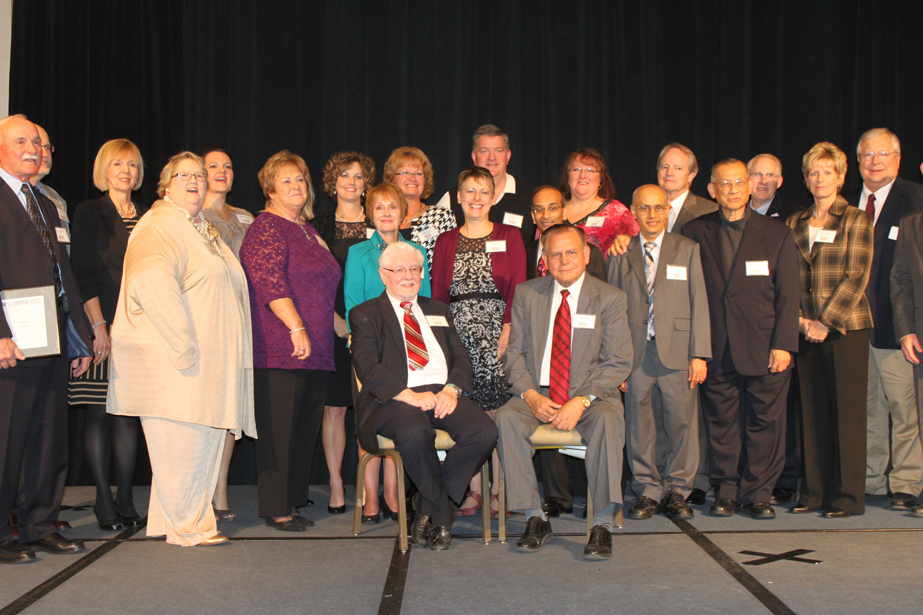 Newman Professor of Biology Surendra Singh, Ph.D., seated at right, was one of 27 individuals and organizations selected as "Health Care Heroes" by the Wichita Business Journal.