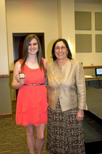 Emilie Leivian (left) receives the St. Catherine Award, presented by Noreen M. Carrocci, Ph.D.