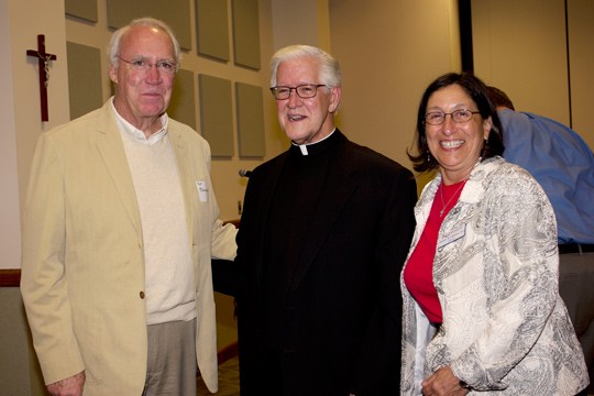 Patrick O'Shaughnessy, left, was among the guests to the reception for Monsignor Robert Hemberger, center. Newman President Noreen M. Carrocci, Ph.D. hosted the event.