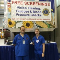Darrin Capps and Rikkie Hemmert at the Kansas Lions Club free screening booth. 