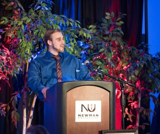 Newman junior Joshua Baalmann helped close the event with song.