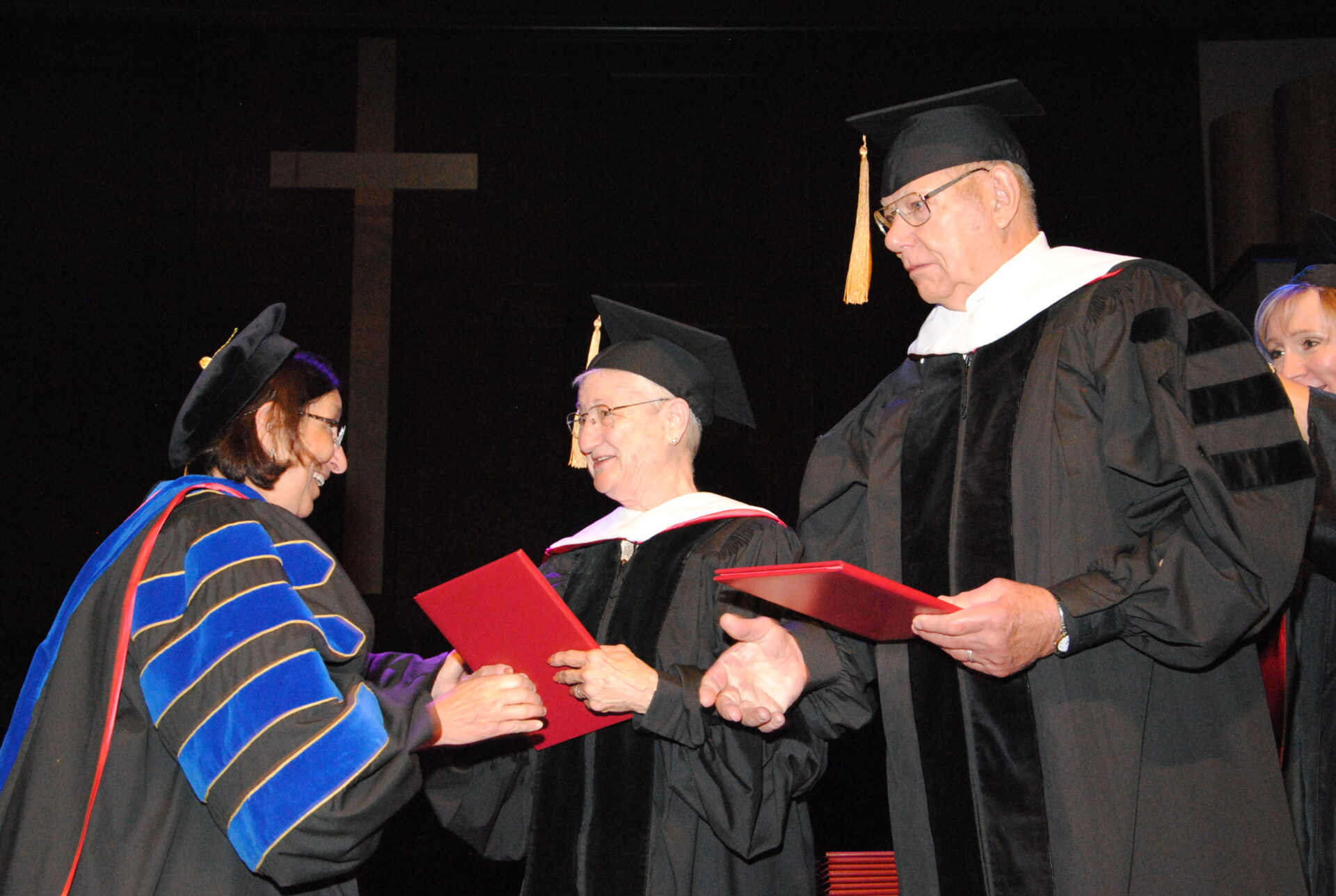 Newman President Noreen M. Carrocci, Ph.D. presents Doctor of Letters, honoris causa to Rosalie and Robert Goebel.