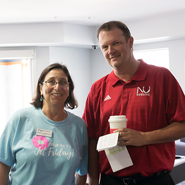 Newman President Noreen M. Carrocci, Ph.D. and Bowling Coach Billy Murphy helped students during the move-in.