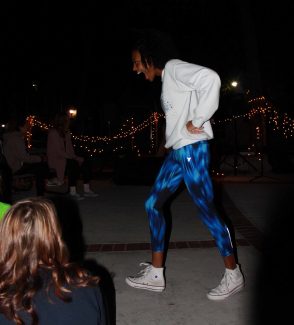 A student dances as the music plays.
