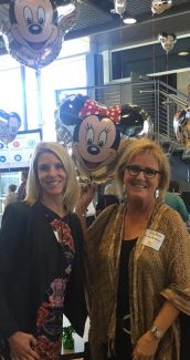 Audrey Hane and Gina Marx pose with a Minnie Mouse balloon.