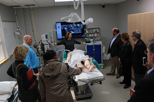 Director of the Nurse Anesthesia Program Sharon Niemann shows legislators new teaching equipment during a tour in Eck Hall.