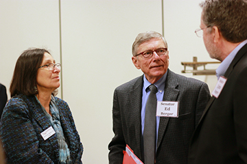 Newman President Noreen M. Carrocci, Ph.D. and Sen. x speak with Rogers.