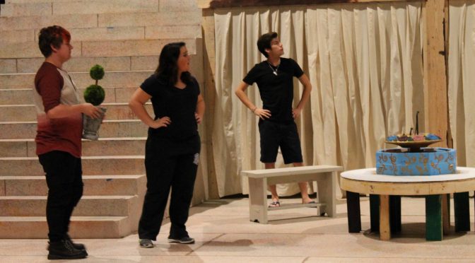 (From left to right) Ieuan Thomas, Taylor Rose, and Carlos Sanchez rehearse a scene from Triumph of Love.