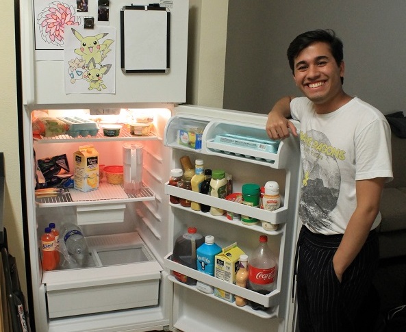 Jose Rojas-Montero shows off the contents of his fridge in Fugate.