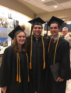 Williams (right) with two friends at the 2016 Newman University Baccalaureate.