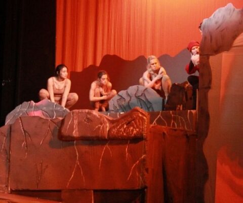(far left) Kelly participated in the 2020 theatre production, "Dante's Inferno."