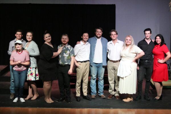 A cast photo following a performance with Smet Theatrics. 