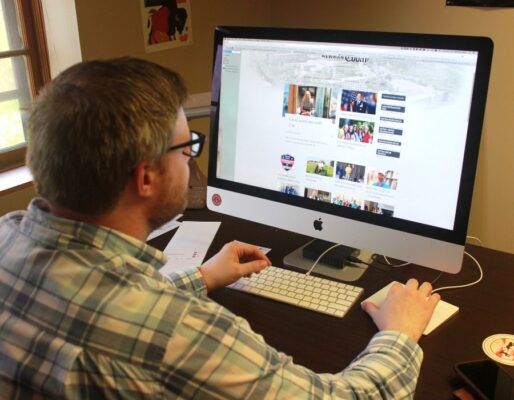 Senior Graphic Designer Matthew Miller tests out the new site design.