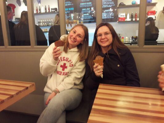 Emma Eck and Kayla Garvert enjoy an ice cream break after leading a Title IX panel at the University of Georgia.