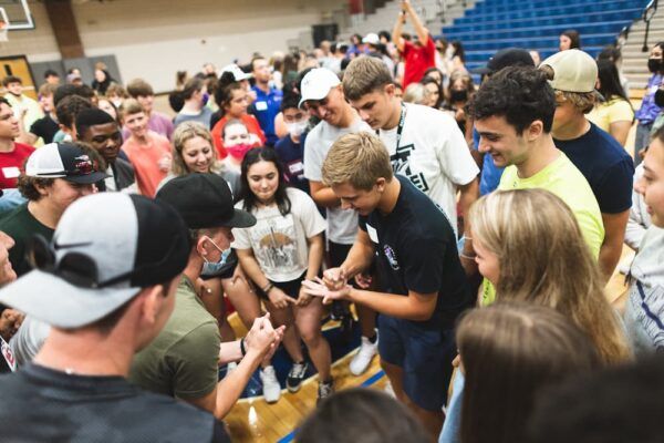 Students compete in a game of rock-paper-scissors.