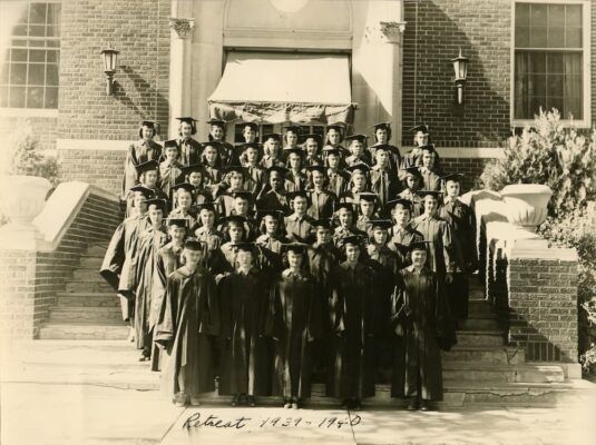 The graduating class of 1939-40 stands outside of Sacred Heart Hall. Photo courtesy of Newman University Archives. 