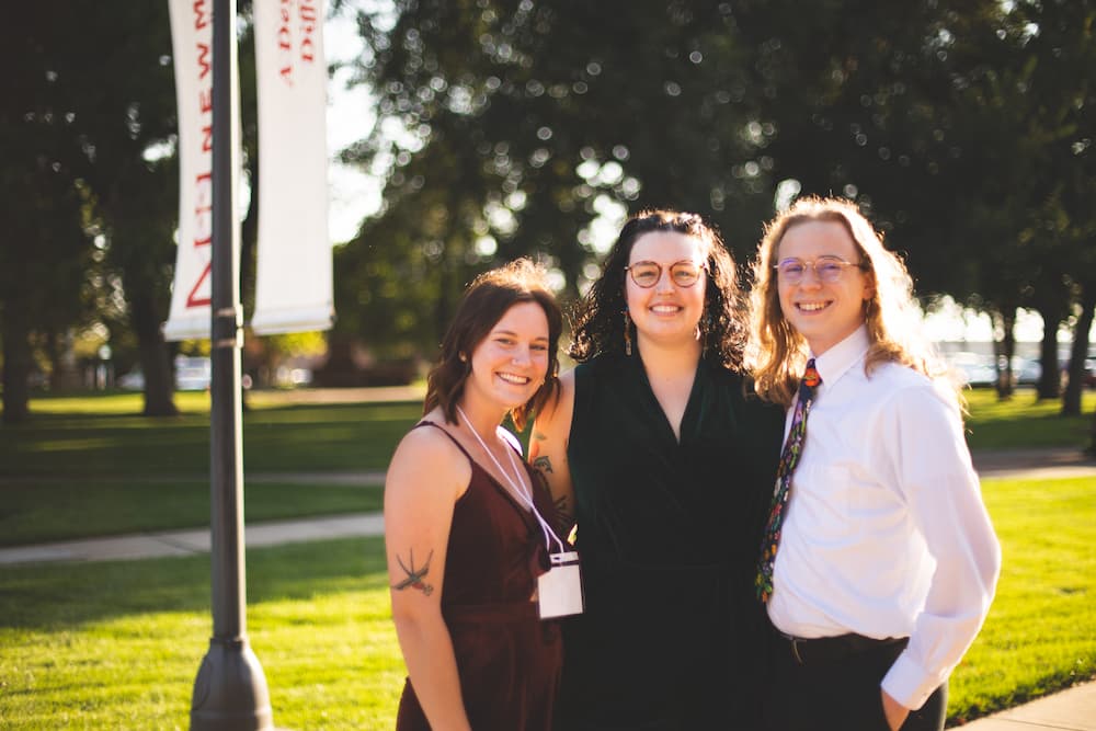 Newman University alumni Carly Sullivan ('21), Madeleine Dellinger ('21), and Matthew Clark ('22).