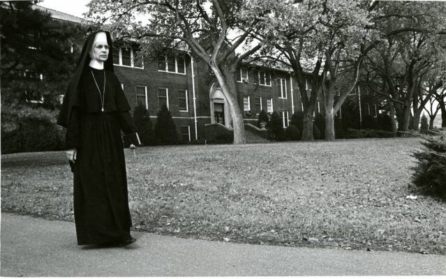 Sister Sylvia Gorges stands outside Sacred Heart Hall. Photo courtesy of Newman University Archives.