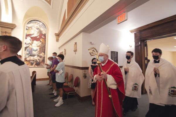 Most Rev. Bishop Carl A. Kemme enters St. John's Chapel during the entrance hymn.