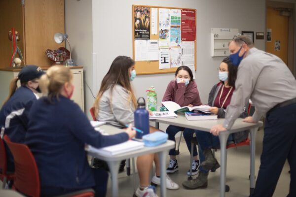 (Far right) Director of the Radiologic Technology Program Jeffery Vaughn works with his students in the classroom.