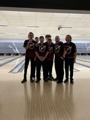 (Far left) Palacios and the 2021-2022 men's bowling team.