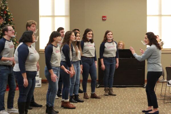 The Newman University Troubadours give a brief performance for the breakfast attendees.