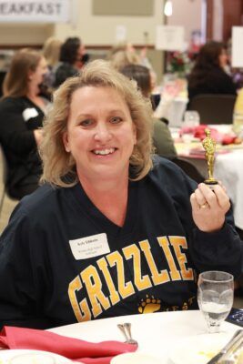 Counselor Kyla Tibbetts of Wichita High School Northwest won a "Dundie" at the breakfast.