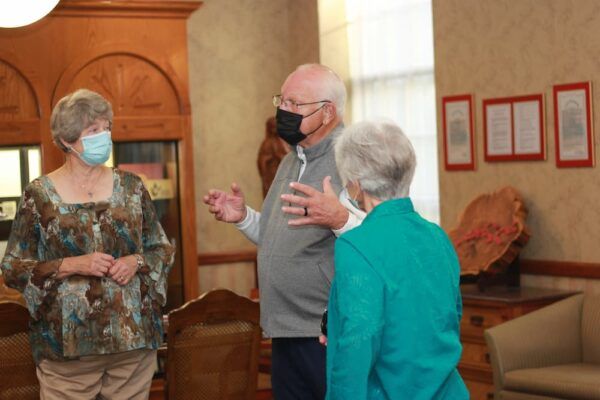 (From left to right) Marie and Bob Pearce speak with director of mission effectiveness Sister Therese Wetta, ASC.