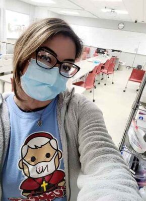 Priscilla Bianchini sports her St. John Henry Newman t-shirt in a Newman nursing classroom.