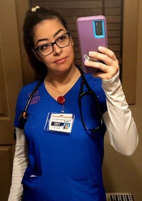 Priscilla Bianchini wears her Newman nursing scrubs.
