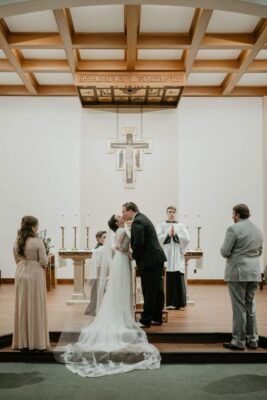 Madeline and Cole Schnieders were married in St. John's Chapel. Photo by Brianna Huynh.