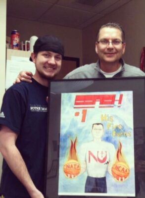 Joshua Prilliman presents his painting to Mark Potter.
