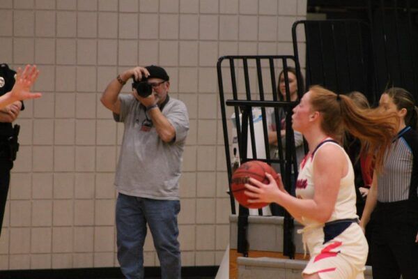 Richard Rico photographs the Newman women's basketball game against Fort Hays State University.