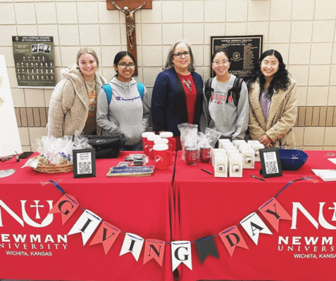 President Kathleen Jagger interacts with students at the student booth during Giving Day 2022.