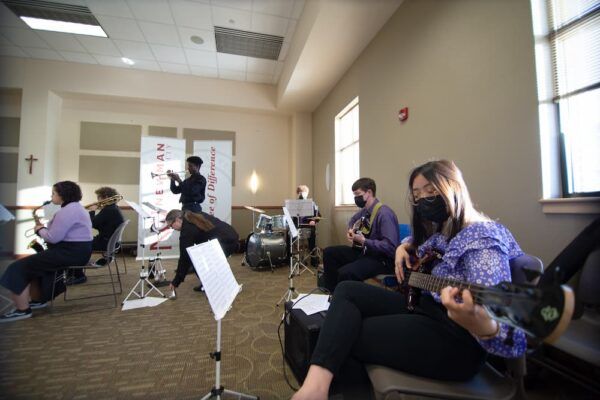 (Far right) Club president Jenny Duong plays the bass guitar for the Jazzy Jets.