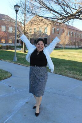 This photo of an excited, arms in the air, Veronica Castaneda-Alferez was taken on Scholars Day Dec. 6, right after she finished a presentation on "Newman University and My Life Transformation."