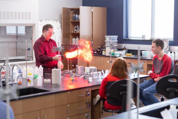 Professor Alan Oberley teaches students chemistry using fire during ISSP.