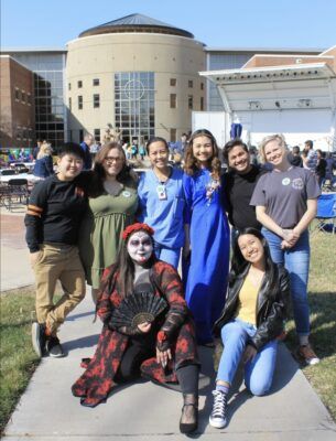 Newman alumni who participated in MCLO's first Cultural Extravaganza attended this year's event. Ami Alvidrez is pictured in back row, far right.