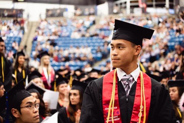 Steven Nguyen stands during the 2022 Newman Commencement ceremony.