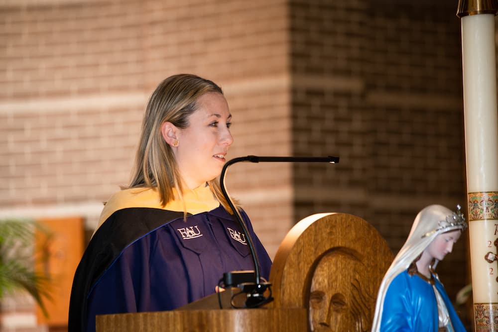 Brittany Stahnke speaks at the 2022 Master of Social Work hooding ceremony for Newman University graduates in Colorado Springs.
