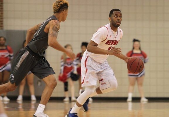 Jalen Love (right) played on the Newman men's basketball team during his time as an undergraduate student.