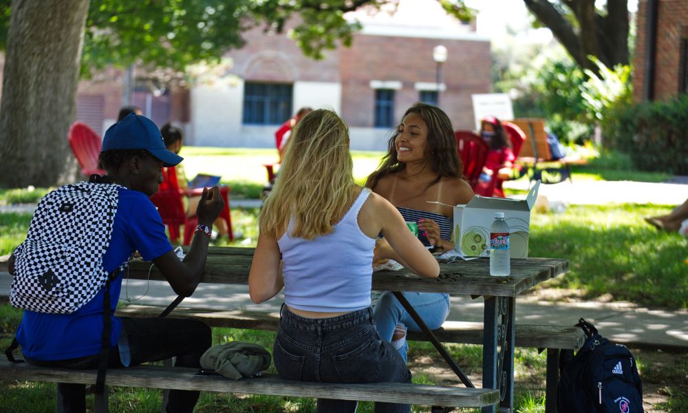 Newman University students enjoy an outdoor cookout following the Matriculation Mass.