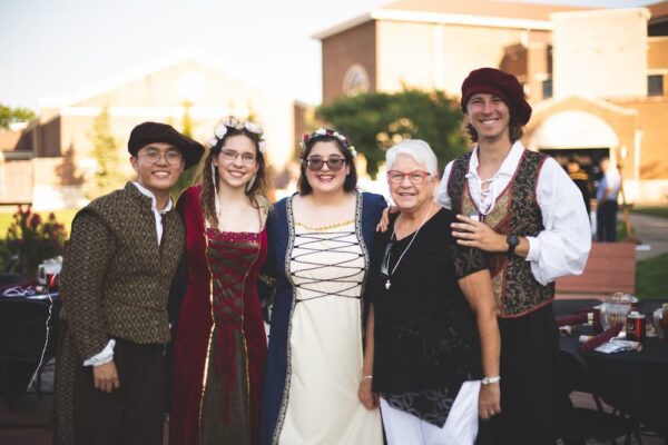 Students dress in Renaissance attire for the 2021 Party on the Plaza.