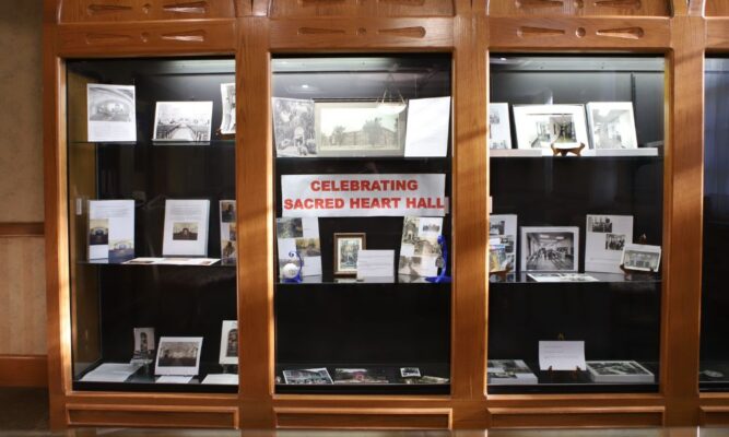 "Celebrating Sacred Heart Hall" in display in the Heritage Room at Newman University.