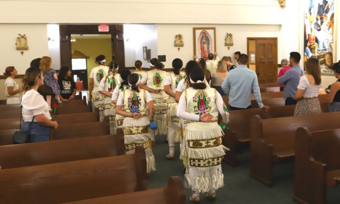 The Matachínes perform a dance in honor of the Nativity of the Blessed Virgin Mary, Our Lady of Guadalupe, as the new mural is hung in St. John's Chapel.