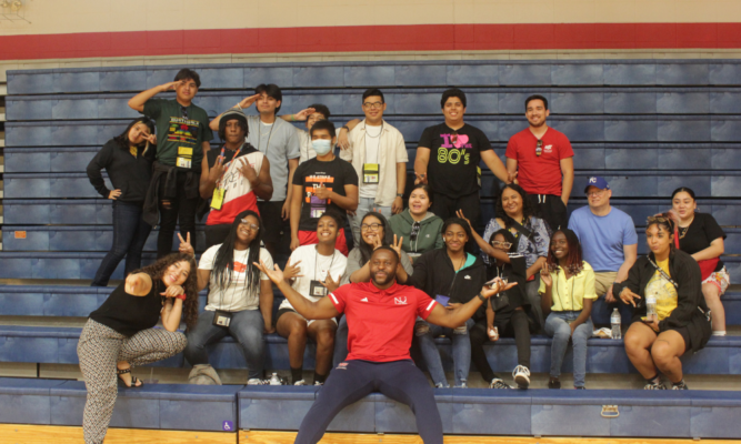 Mendel Folefac poses with students from the Upward Bound Program