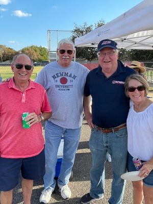 Newman University alumni attend a soccer tailgating event from the Newman Alumni Association.