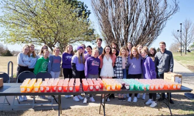 Shelby Bussman (front center) hosts a Walk for Epilepsy with her Derby community. (Courtesy photo)